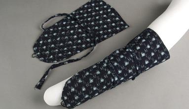 Arm protectors for working in the fields, navy in color with white dots